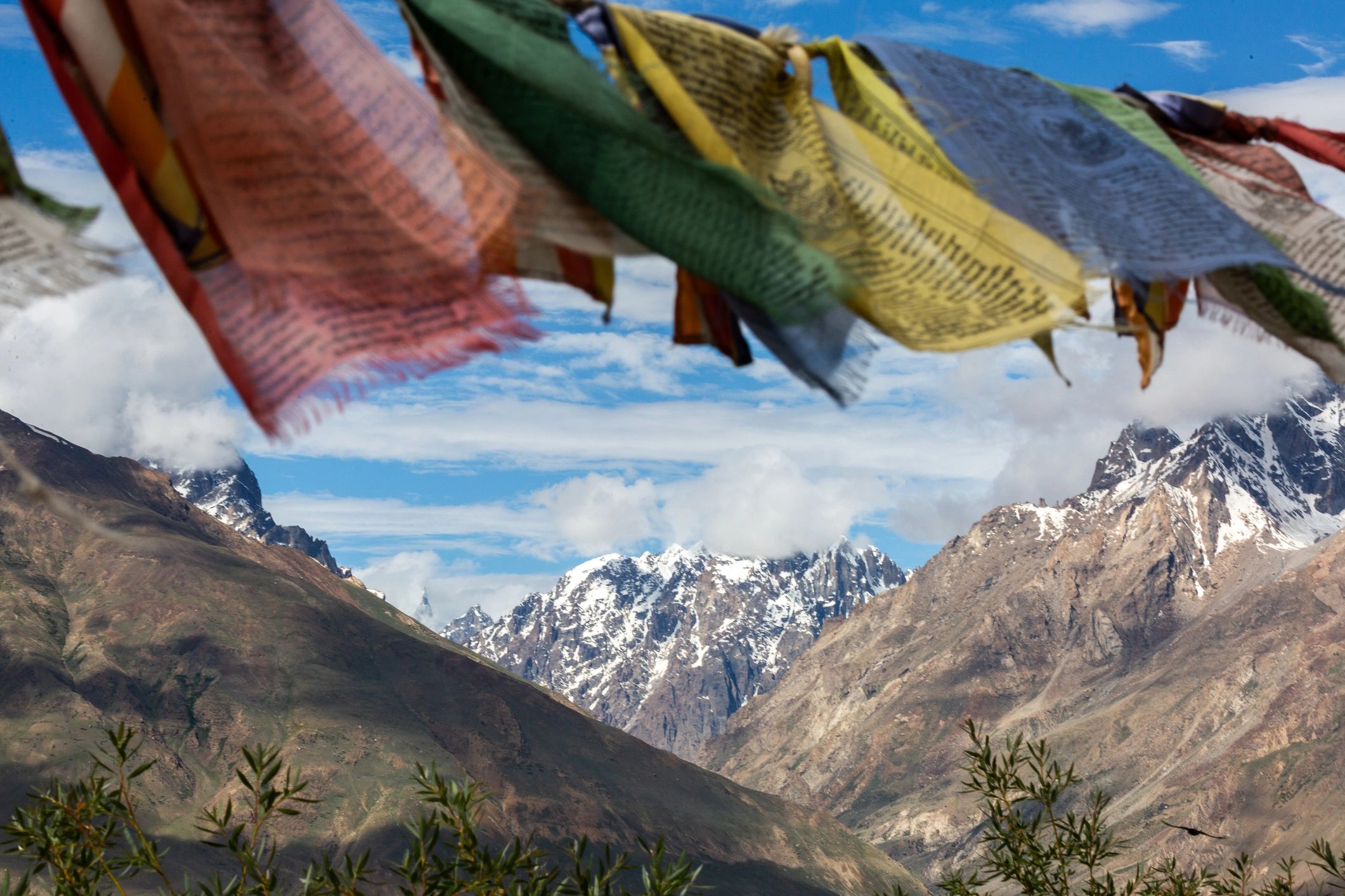 Mountain landscape with prayer flags representing culture and place
